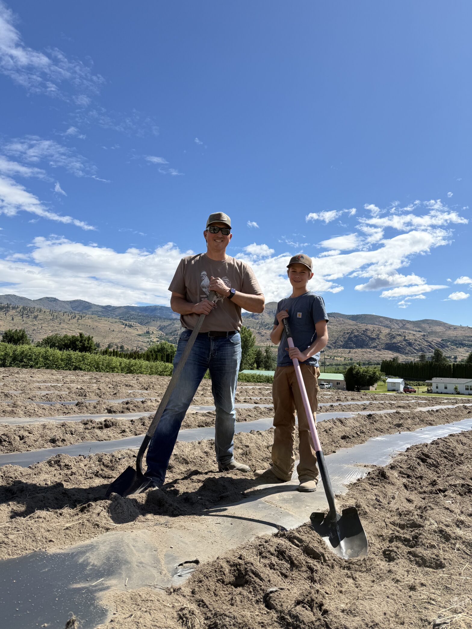 Tillage and soil health in question — Chad and Carston Steiner with shovels in the freshly tilled pumpkin patch at Chelan Valley Farms